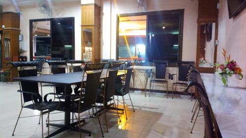 a dining room with a table and chairs at Hua Hin Euro City Hotel in Hua Hin
