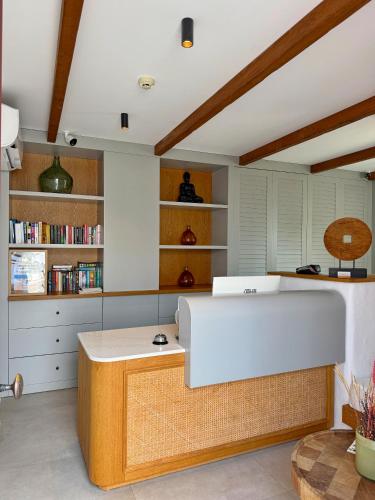 a room with a desk and a book shelf at Nomad Hotel Side - Adults Only in Side