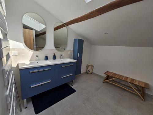 a bathroom with a blue sink and a mirror at Le Domaine de Champerou - Chambres d'hôtes in Cabariot