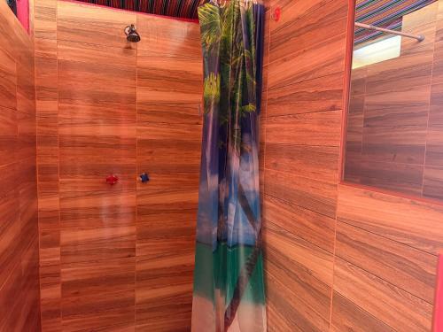 a vase in a room with a wooden wall at Sky Dome Peru in Cusco
