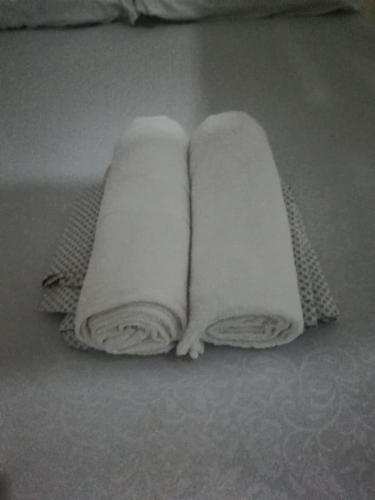 two towels are sitting on a bed at MafiaSeaview in Kilindoni