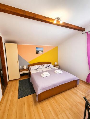 a bedroom with a large bed in a room at Camp Krka in Lozovac