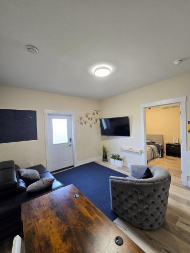 a living room with a couch and a table at 1 bedroom apartment in Halifax