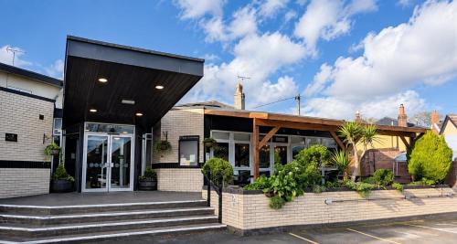 a house with a black roof at The Park Hotel - Sure Hotel Collection by Best Western in Diss