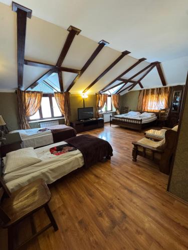a large room with two beds and a couch at Georgios Ranch in Tsodoreti