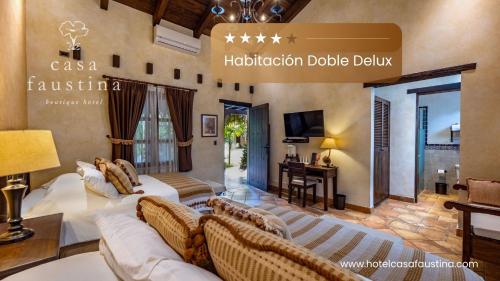 a living room with a couch and a table at Casa Faustina Boutique Hotel in Antigua Guatemala