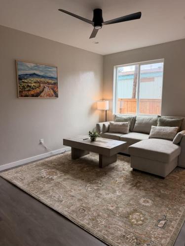 a living room with a couch and a coffee table at New Modern 2 Bedroom Apartment in Anchorage
