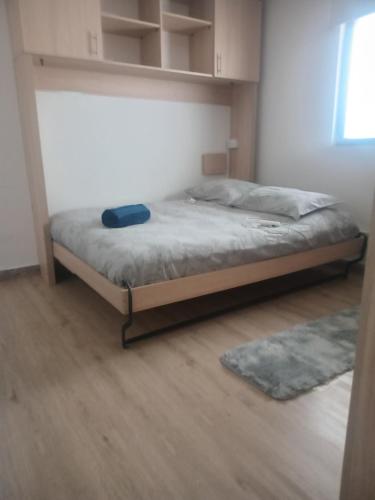 a bedroom with a bed in a room at El Colorado 21, Hasparren in El Colorado