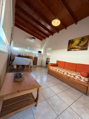 a living room with a couch and a table at Complejo La Querencia de Colón in Colón