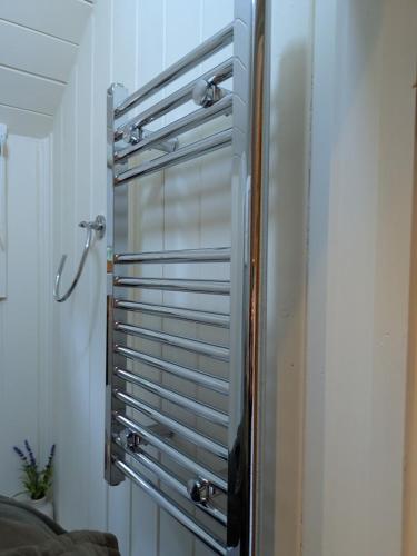 a room with a window with blinds on it at The Willows in Scarisbrick