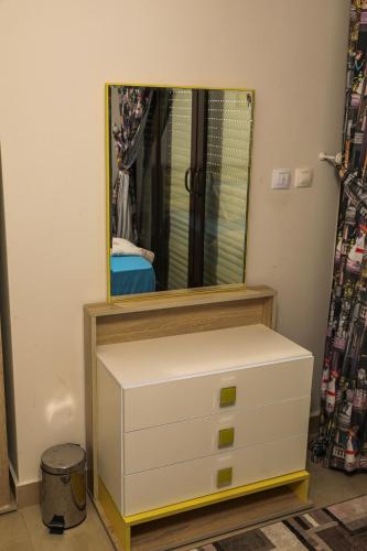 a dresser with a mirror on top of it at Luxury Marassi Villa on Lagoon in El Alamein