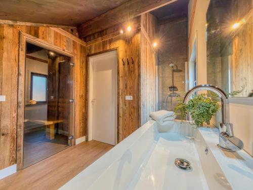 a bathroom with a white tub and a sink at Auszeit am Afritzer See in Afritz
