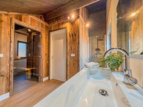a bathroom with a white tub and a sink at Seeperle in Afritz