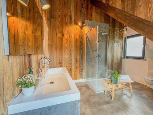 a bathroom with a sink and a shower at Alpenchalet Kärntnerglück in Afritz