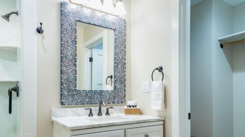 a bathroom with a sink and a mirror at The Top Shelf by AvantStay in Paso Robles