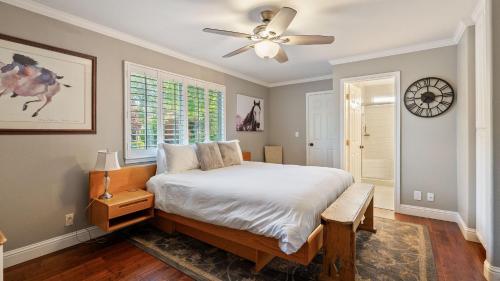 a bedroom with a bed and a ceiling fan at Summer Place by AvantStay in Templeton