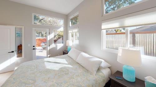 a bedroom with a bed and some windows at Twice is Nice by AvantStay in Paso Robles
