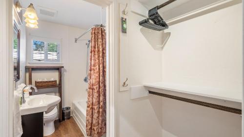 a bathroom with a sink and a toilet at 7th Street Sanctuary by AvantStay in Paso Robles