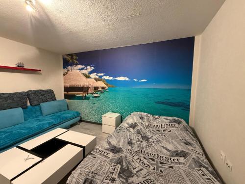 a room with a wall mural of the ocean at Ocean 300m Gare Centre ville Wifi Parking gratuit in Belfort