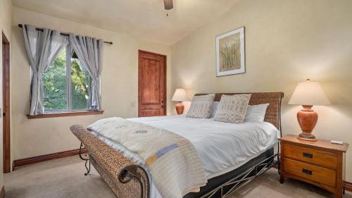 a bedroom with a large bed and a window at Vita Amorosa by AvantStay in Atascadero