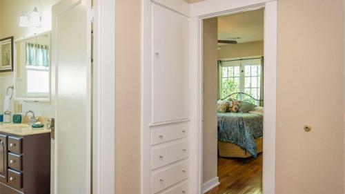 a room with a bedroom with a bed and a mirror at The Sycamore by AvantStay in Paso Robles
