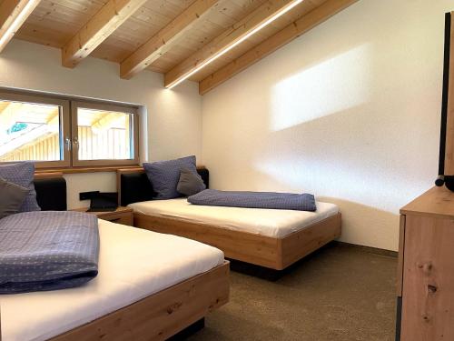 a room with two beds in a room at Panoramic view apartment Kaunergrat in Kaunerberg