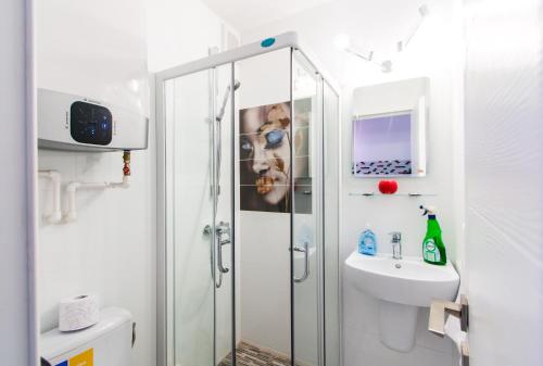 a bathroom with a shower and a sink at Belvedere Danubius in Galaţi