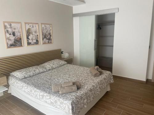 a bedroom with a bed with two towels on it at La Via delle Rose in Alimena