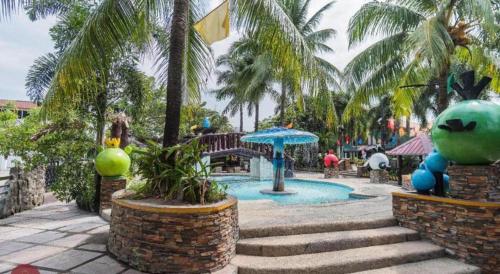 a resort with a swimming pool and palm trees at Sioland Grand Premier Hotel Candelaria in Candelaria