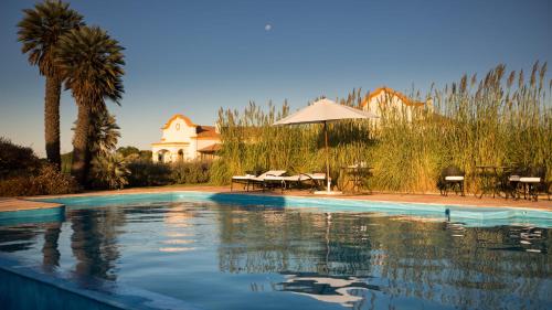 The swimming pool at or close to El Colibri - Relais & Châteaux