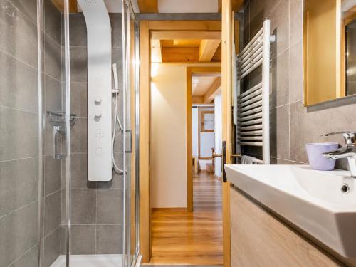 a bathroom with a sink and a shower at Chalet - Margherita in Sappada