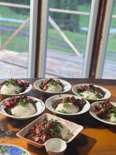 a group of plates of food on a table at OrdoLife in Mineralʼnyy Istochnik Altyn-Arasan