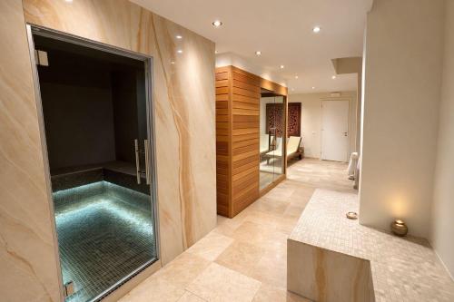 a bathroom with a swimming pool in a room at Panorama Apartment in Trieste