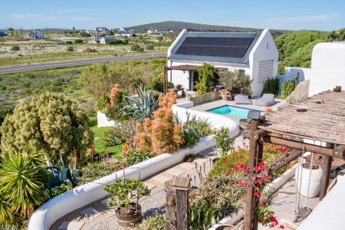 an aerial view of a house with a swimming pool at L'abri in Langebaan