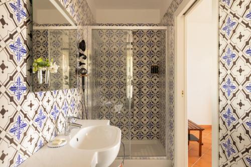 a bathroom with a sink and a shower at Villa Oriana Relais in Sorrento