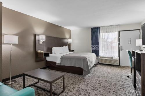 a hotel room with a bed and a table at Quality Inn Kinston Hwy 70 in Kinston