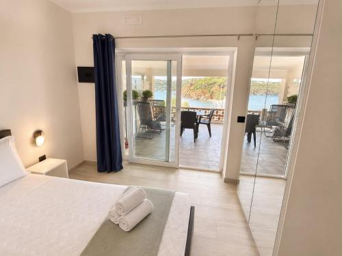 a bedroom with a bed and a view of the ocean at Pareti di mare in Capoliveri