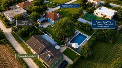an aerial view of a house with a pool at Pegasus Pool Villas Kavala in Kavála