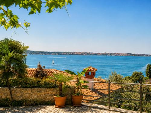 a house with a view of the water at Apartment Gaia with private parking in Portorož