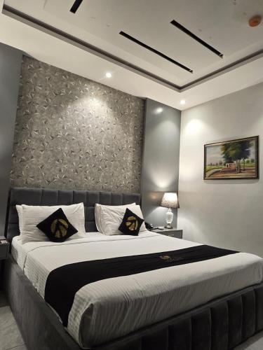 Krevet ili kreveti u jedinici u okviru objekta Palmtree Hotel