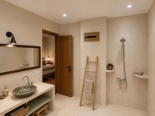 a bathroom with a sink and a mirror and a shower at DAR LOUKA - atlas retreat en terre berbère in Tahannout