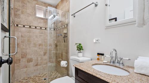 a bathroom with a shower and a toilet and a sink at Paso on Oak by AvantStay in Paso Robles