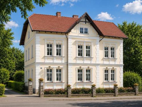 a white house with a red roof at Residenz Royal in Gmünd