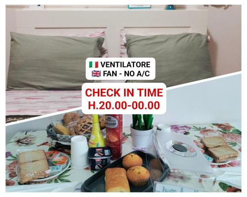 a sign that reads check in time on a bed at La Perla B & B CHECK IN TIME DA FROM H 20 PM in Ciampino