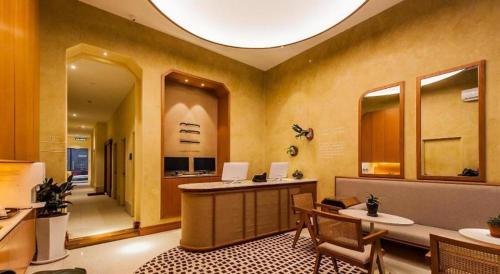 a room with a desk with two laptops on it at Mozu Hotel SP in Kuala Lumpur