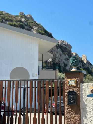 a house with a fence with a cactus on it at Albatros Apartments in Licata