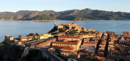 an aerial view of a town on the edge of a body of water at Appartamenti Bellavista - HelloElba in Portoferraio