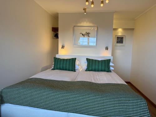 Cama ou camas em um quarto em Green Hotel