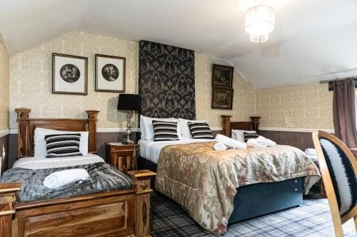 Postelja oz. postelje v sobi nastanitve Schooner Hotel