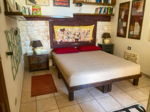 a bedroom with a large bed in a room at Guesthouse Nuvole in Olbia